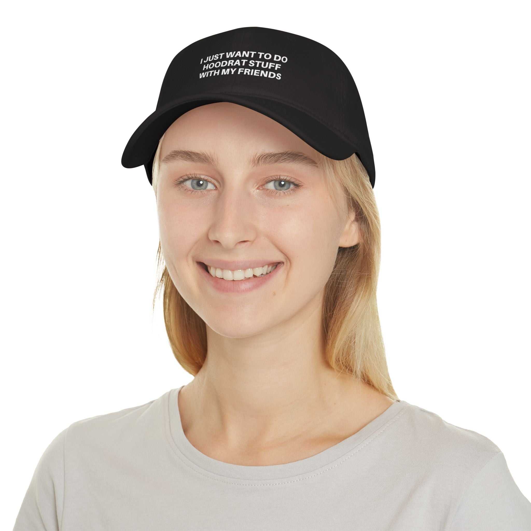 Young woman wearing black Low Profile Baseball Cap with embroidered text "I JUST WANT TO DO 'HOODRAT STUFF' WITH MY FRIENDS"