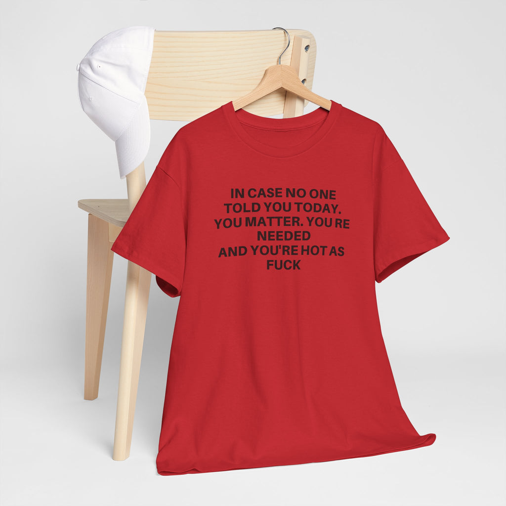 White "You Matter" t-shirt by Printify displayed on a wooden surface with soft lighting.